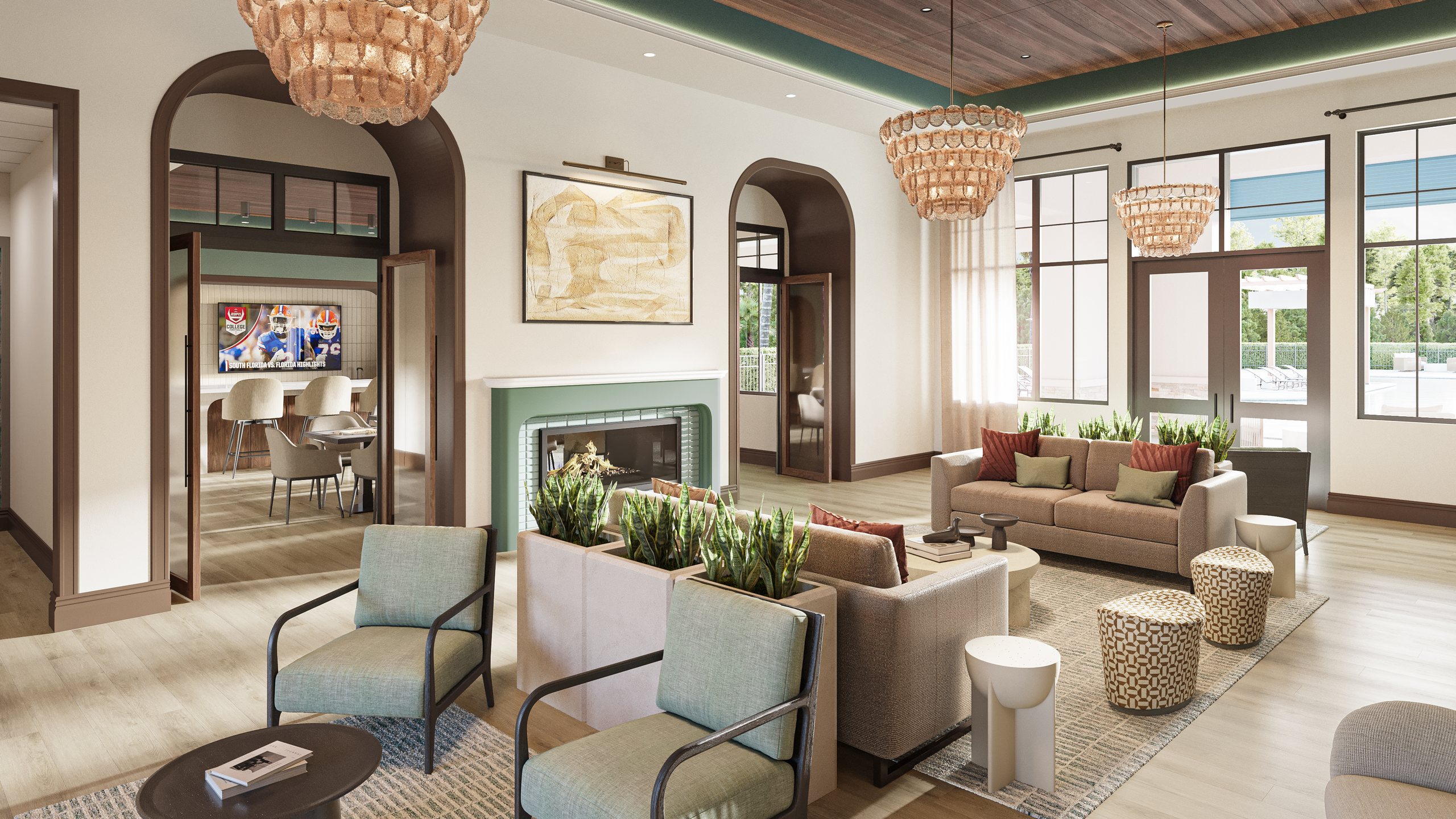 Alta Key clubhouse lounge with fireplace, armchairs and chandeliers