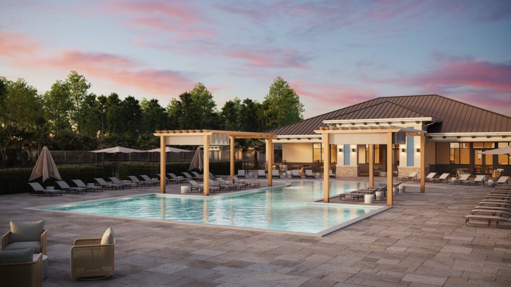 The pool and pergola lit at dusk beside the clubhouse