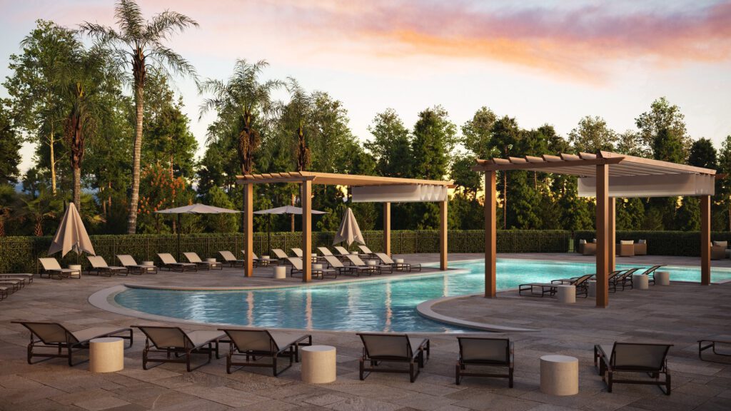 Resort-style pool with shaded pergolas and sun loungers at sunset